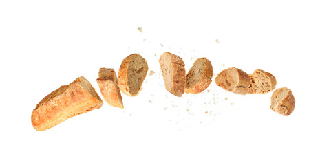 Freshly baked baguette. Pieces of bread in air on white background