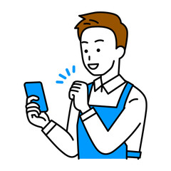 スマートフォンの画面を見てガッツポーズで喜ぶエプロン姿の男性