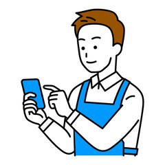 スマートフォンを操作するエプロン姿の男性