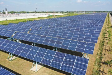 Solar Farm (solar cell) on sunny day background with electric power generation in agricultural area...