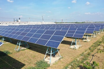 Solar Farm (solar cell) on sunny day background with electric power generation in agricultural area...