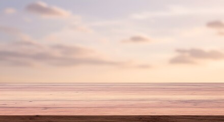 Obraz premium Serene seascape with pastel sky and calm ocean at sunset. Minimalist beach scenery for relaxation concept. Travel inspiration and tranquil vacation background with copy space.