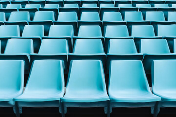 Fototapeta premium Rows of Light Blue Empty Seats. Chairs in a stadium or auditorium setting. Clean, structured view.