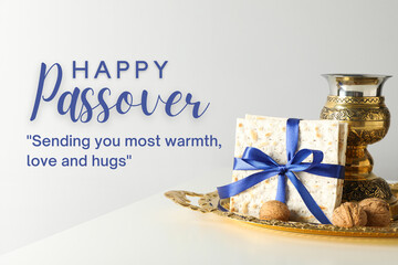 Passover, matzah with a bowl, nuts and greeting text, on a light background © Atlas