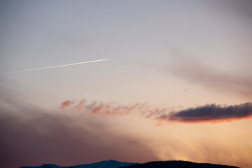 soft hues over the rocky mountains at sunset