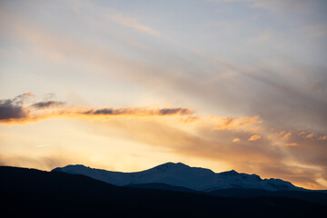 soft hues over the rocky mountains at sunset