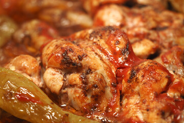 Savory chicken dish simmering with green peppers and spices