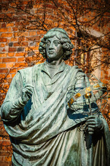 Fototapeta premium the Nicolaus Copernicus Monument in Torun's historic market square