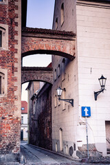 narrow street with beautiful architectural details during dusk in a historic town