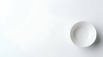 Isolated White Ceramic Bowl On A Plain White Background Viewed From Above With Soft Lighting And Subtle Shadows
