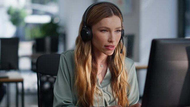 Support specialist talking headset working computer at helpdesk space closeup.