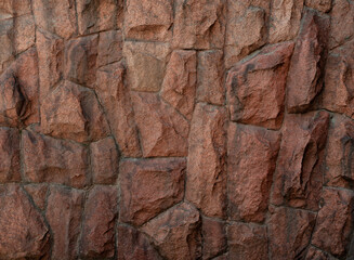Stunning Close-Up of Textured Granite Wall Surface with Natural Brown Tones