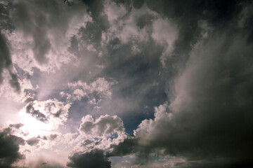 sun piercing dark winter sky 