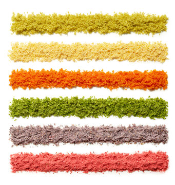 Colorful Variety of Culinary Powders on White Background