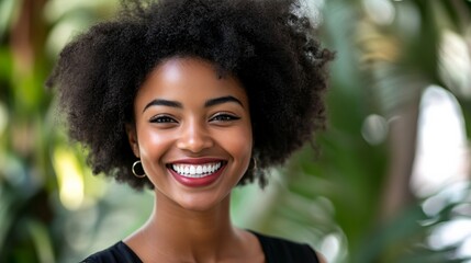 African American woman beams with joy, radiating warmth and confidence.