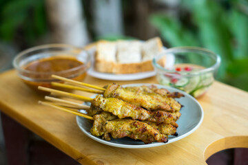 Grilled pork skewers with side dishes, Thai food