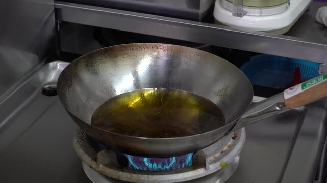 Deep fried oil in a wok 