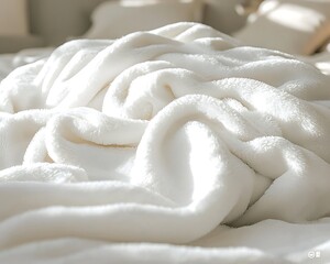 Soft white blanket on bedroom bed