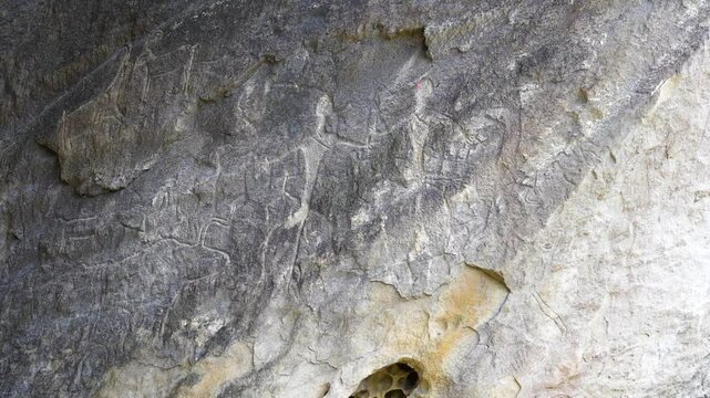 Prehistoric rock carvings in Qobustan, Azerbaijan, depicting early human life and ancient civilizations