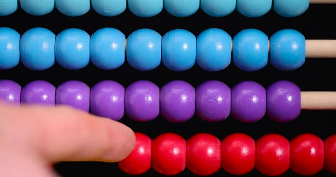 colorful wooden beads on abacus for children's play, wooden children's abacus for learning and development