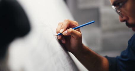 Hand, drawing or man with inspiration, architecture or blueprints for renovation project. Urban development, closeup or engineering with paper, charts or property sketch with deadline and creativity