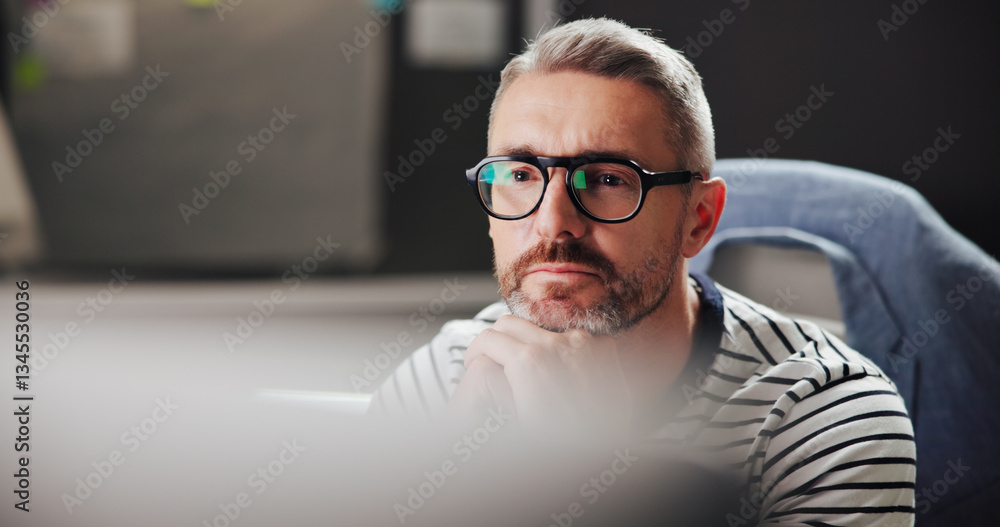 Poster Browsing, night and man with computer, office and creative for web design with software or serious. Overtime, graphic designer and mature person with glasses in business, deadline or tech for project