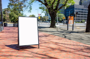Background texture of a blank white advertising board or sandwich board mockup standing on a...