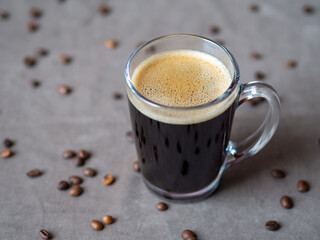 Glass mug with coffee and coffee beans. Start a new day with fragrant coffee. Coffee bean prices in the world