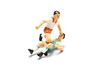 Fototapeta premium A soccer player toy is playing football.