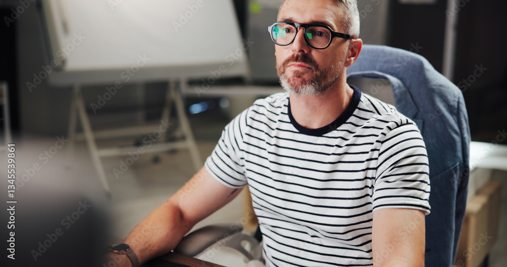 Aufkleber Serious, night and mature man with computer, office and creative for web design with software or browsing. Overtime, graphic designer and person with glasses in business, deadline or tech for project