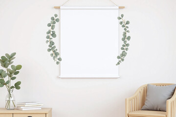 A white scroll with eucalyptus branches on both sides hangs on a light  colored wall