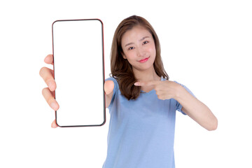 Young attractive Asian woman in a blue shirt smiling and pointing at a big smartphone with a blank white screen, isolated on a transparent background, promoting mobile app, digital online service