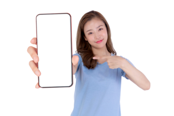 Young attractive Asian woman in a blue shirt smiling and pointing at a big smartphone with a blank white screen, isolated on a transparent background, promoting mobile app, digital online service
