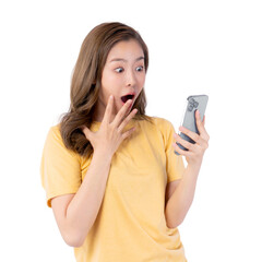 Surprised Asian woman in a yellow casual shirt looking at a smartphone with wide eyes and open mouth, isolated on a transparent background, expressing shock or amazement at unexpected news or content