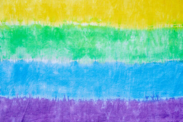 colourful tie dye pattern hand dyed on cotton fabric abstract texture background.