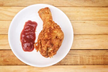 Fried chicken legs with tomato sauce