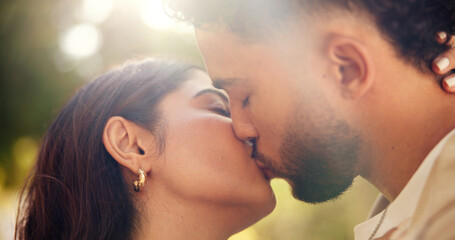 Hug, kiss and romance for couple, outdoor and bonding for commitment in relationship and affection. Park, man and woman on date with love, care and celebration for anniversary, nature or people