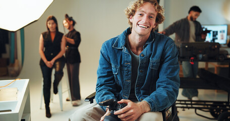 Camera, photography and portrait with happy man in studio for review of film or photoshoot footage. Behind the scenes, creative or smile of photographer with makeup artist and model getting on set