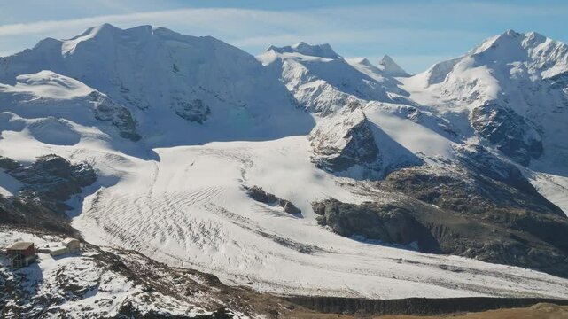 Sweeping view of Pers icy Glacier and jagged mountain ridges in Switzerland