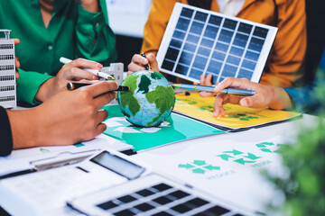 Young Asian business team discussion reusable product in office,start up eco-friendly business,environmental protection,sustainable business model,ESG strategy,team meeting,people work at home concept