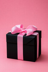 Obraz premium Black gift box with pink bow