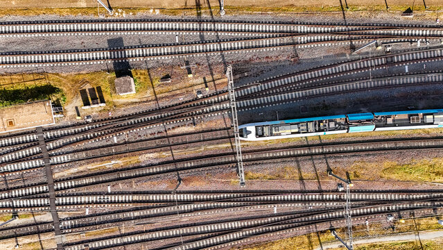 Railroad, train tracks and train aerial drone view from above, railway station in the Netherlands, transportation and public transport infrastructure concept