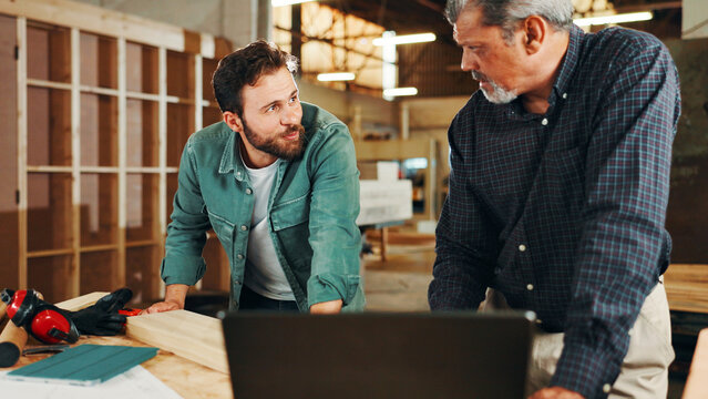 Manufacturing, carpenter or people on laptop in workshop for factory, check inventory or furniture production. Woodworking, carpentry and online update for timber, lumber and construction business - Powered by Adobe