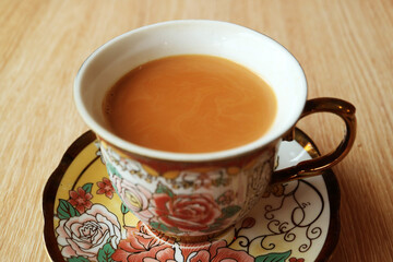 A Cup of Freshly Brewed Masala Chai Tea on Wooden Table