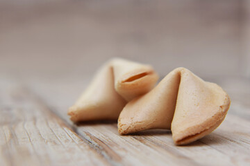 Whole fortune cookies filled with piece of paper to message or telling selective focus