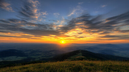 Golden Sunset Over Hillside Meadow with Dramatic Sky and Vibrant Colors