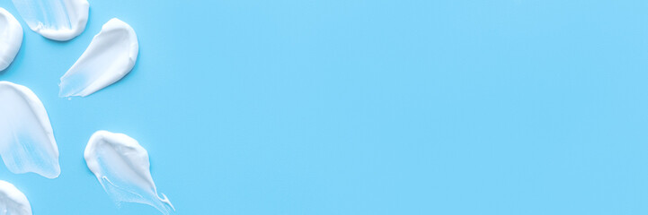 A smear of cream on a light background. Beauty concept. Web banner