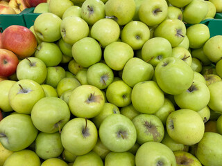 Green apples on a market stall. Close-up of green apples.