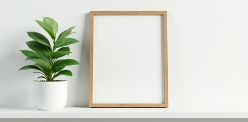 Elegant picture frame, green plant on white shelf, shelf, clean