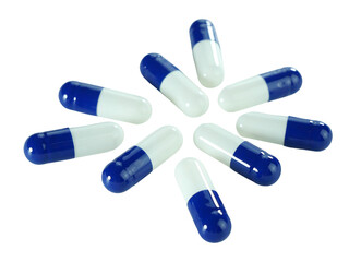 Bulk blue and white capsule pills isolated on white background.